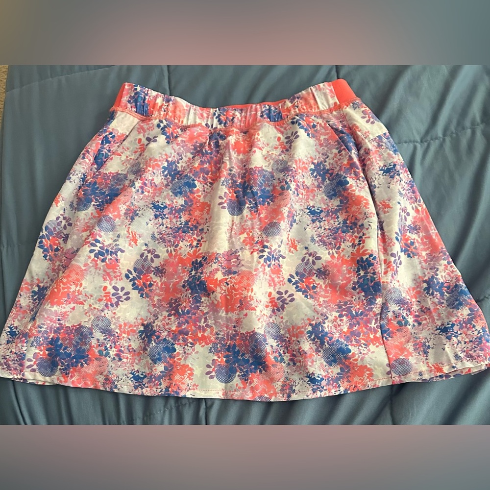 KYODAN GOLF size XS Orange and Pink pleated activewear skirt.